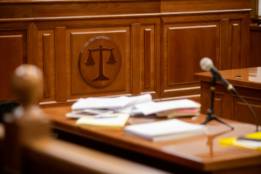  Translated legal documents spread over a court desk.