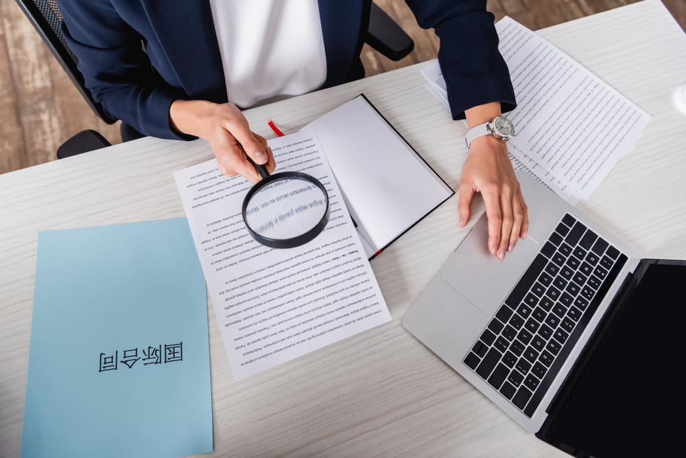 a woman conducting human translaiton for a legal document