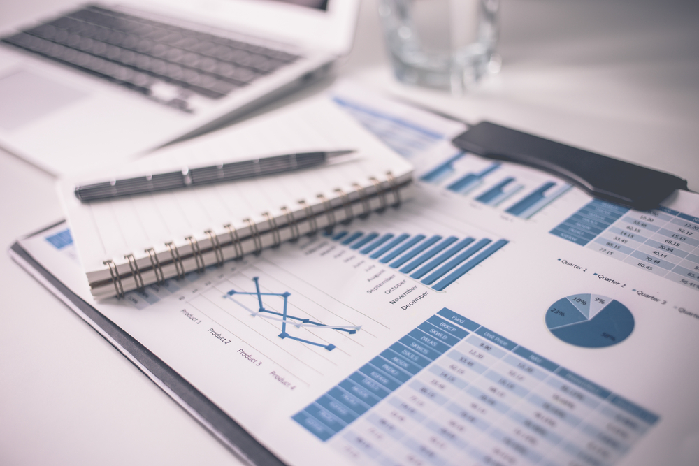 Translated financial reports on a desk.