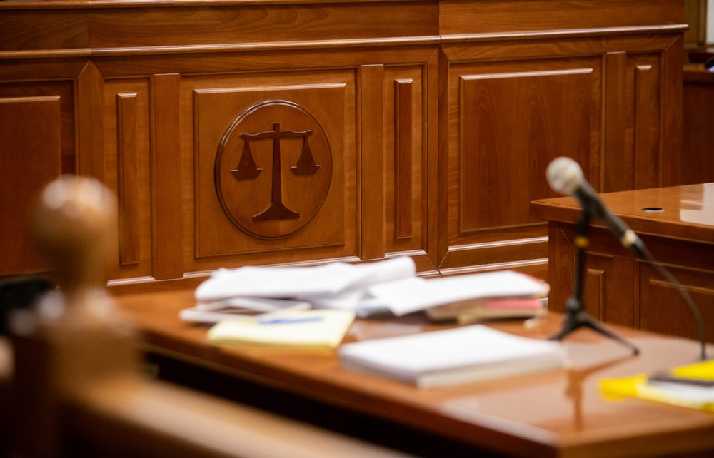 Translated legal documents spread over a court desk.